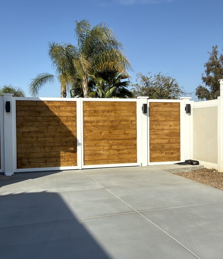 Custom Driveway Gate & Pedestrian Entry – Wood, Metal & Architectural Lighting